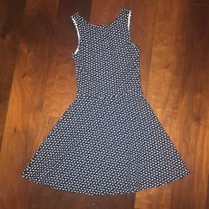 Girls dress with a blue, white, and black pattern.